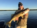 Steve's friend Jordan Weeks with a big walleye he caught while they trolled together in June — it hit a 10" Slammer!