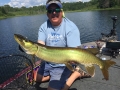 In hot, flat calm, sunny conditions, Steve triggered this musky with a 7" Slammer in a boatside rise.