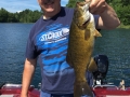 Jigging a 1/4-oz. jig with a Mr. Twister Sassy Shad lured this 20" smallmouth for Steve.