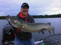 Clouds moving in and a terrific musky for Steve on a Swimmin' Dawg over 35 feet of water.