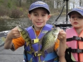 Steve's grandsons, Conner and Ethan, love to fish. (Ethan wouldn't hold any fish for this photo.)