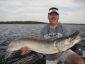 Steve with a long musky caught from a sand-bottomed area.