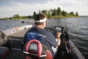 Steve Heiting makes note of baitfish on his graph as he approaches a spot he'll fish for muskies.